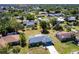 Bird's-eye view showcases home with mature landscaping in a suburban neighborhood at 963 Kennwood Nw Ter, Port Charlotte, FL 33948