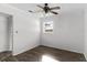 This bedroom has wood-look floors, a ceiling fan and one window for natural light at 102 21St Ne St, Bradenton, FL 34208