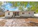 Single-story home featuring a screened-in entryway and neutral paint, awaiting a personal touch at 102 21St Ne St, Bradenton, FL 34208