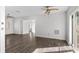Open living space showcasing wood-look floors, ceiling fans, and lots of natural light at 102 21St Ne St, Bradenton, FL 34208