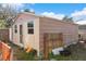 View of shed with paneled siding and small windows at 102 21St Ne St, Bradenton, FL 34208