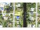 Aerial view of the property and neighborhood with water access, showcasing location, lot and nearby homes at 1182 Yorkshire St, Port Charlotte, FL 33952