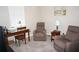Bedroom featuring desk, comfortable seating, and neutral decor bathed in natural light at 1182 Yorkshire St, Port Charlotte, FL 33952