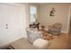 Welcoming entryway with decorative chairs, side table, and stylish decor at 1182 Yorkshire St, Port Charlotte, FL 33952