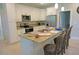 Well-lit kitchen featuring white cabinetry, granite counters, and stainless steel appliances at 1182 Yorkshire St, Port Charlotte, FL 33952