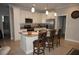 Spacious kitchen featuring an island with bar seating, stainless steel appliances, and sleek, modern cabinetry at 1182 Yorkshire St, Port Charlotte, FL 33952