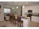 Open-concept kitchen with a breakfast bar, granite countertops, and stainless steel appliances, perfect for entertaining at 1182 Yorkshire St, Port Charlotte, FL 33952