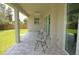 Relaxing covered patio with pavers, perfect for enjoying the backyard view at 1182 Yorkshire St, Port Charlotte, FL 33952