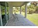 Covered outdoor patio with pavers overlooking lush backyard at 1182 Yorkshire St, Port Charlotte, FL 33952