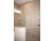 Stylish shower design boasts unique tile work and modern glass enclosure at 1182 Yorkshire St, Port Charlotte, FL 33952