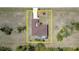 This aerial view of the property displays the home's layout, pool, and surrounding grounds at 145 Brig E Cir, Placida, FL 33946