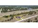 Aerial view showcases the property's location and surrounding neighborhood with road frontage at 145 Brig E Cir, Placida, FL 33946