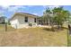The home's backyard includes a screened lanai area and standard fencing at 145 Brig E Cir, Placida, FL 33946