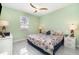 Cozy bedroom with a ceiling fan, offering a comfortable and relaxing atmosphere with plenty of light at 145 Brig E Cir, Placida, FL 33946