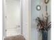 Hallway bathroom showcasing a pristine toilet and tile floors, with easy access from nearby spaces at 15172 Mcgraw Ave, Port Charlotte, FL 33953