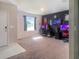 Cozy secondary bedroom/flex space featuring gaming set ups, a modern aesthetic, and neutral walls at 15172 Mcgraw Ave, Port Charlotte, FL 33953