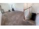 Versatile bonus room with stairs, and ample space for recreation or a home gym setup at 15172 Mcgraw Ave, Port Charlotte, FL 33953