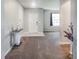 Inviting entryway featuring neutral walls, tile flooring, and modern decor at 15172 Mcgraw Ave, Port Charlotte, FL 33953