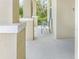 Open-air porch with stone pillars and space for seating, providing a welcoming entryway at 15172 Mcgraw Ave, Port Charlotte, FL 33953