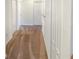 Hallway with neutral carpet and white walls with closet doors at 15172 Mcgraw Ave, Port Charlotte, FL 33953