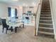 Open-concept kitchen and dining area with white cabinets and a central island, great for entertaining at 15172 Mcgraw Ave, Port Charlotte, FL 33953