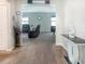 Open-concept living area with neutral colors, leading into another entertainment space with a modern aesthetic at 15172 Mcgraw Ave, Port Charlotte, FL 33953