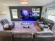 Entertainment space featuring recliner seating, modern lighting, and a media center for ultimate comfort at 15172 Mcgraw Ave, Port Charlotte, FL 33953
