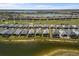 Expansive aerial view of a serene golf community with homes situated by lake and green space at 15931 Sugar Hill Dr, Punta Gorda, FL 33982
