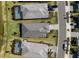Rooftop aerial view showcasing backyard pools, and modern neighborhood layout close to a walking path at 15931 Sugar Hill Dr, Punta Gorda, FL 33982