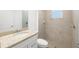 Neutral bathroom features a granite vanity and tiled shower at 15931 Sugar Hill Dr, Punta Gorda, FL 33982