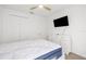 Bright bedroom with closet, tv, ceiling fan, and dresser with multiple drawers at 15931 Sugar Hill Dr, Punta Gorda, FL 33982
