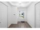 Bright foyer with neutral walls, wood-look floors and a glass front door at 15931 Sugar Hill Dr, Punta Gorda, FL 33982