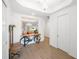 Bright hallway showcasing modern decor, wood-look flooring and a glimpse of the dining area at 15931 Sugar Hill Dr, Punta Gorda, FL 33982