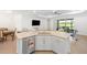 Kitchen island overlooking living area and views of the lake at 15931 Sugar Hill Dr, Punta Gorda, FL 33982
