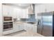 Updated kitchen with stainless appliances, granite countertops, and tiled backsplash at 15931 Sugar Hill Dr, Punta Gorda, FL 33982