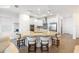 Bright kitchen featuring a large island with seating, stainless steel appliances, and white cabinetry at 15931 Sugar Hill Dr, Punta Gorda, FL 33982