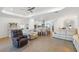 Spacious living area featuring neutral tones, an open layout and wood flooring at 15931 Sugar Hill Dr, Punta Gorda, FL 33982