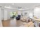 Bright, open-concept living area with sliding glass doors and lake views at 15931 Sugar Hill Dr, Punta Gorda, FL 33982