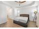 Bright main bedroom with tray ceiling, wood-look flooring, and a neutral color palette at 15931 Sugar Hill Dr, Punta Gorda, FL 33982