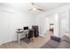 Bright office features wood-look flooring, desk and adjacent sitting area at 15931 Sugar Hill Dr, Punta Gorda, FL 33982
