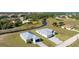 A captivating aerial shot of a home nestled in a thriving neighborhood, showcasing its beautiful landscaping and nearby creek at 17476 Vellum Cir, Punta Gorda, FL 33955