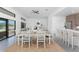 Bright dining area with views of the outdoor patio, seamlessly connected to the kitchen, perfect for entertaining guests at 17476 Vellum Cir, Punta Gorda, FL 33955