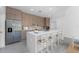 Modern kitchen boasts sleek cabinets, stainless steel appliances, and a large center island with counter seating at 17476 Vellum Cir, Punta Gorda, FL 33955