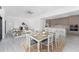 Open-concept living space seamlessly connects the dining, living, and kitchen areas, ideal for modern living and entertaining at 17476 Vellum Cir, Punta Gorda, FL 33955