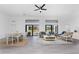 Spacious living area with an open design, connecting the dining and living spaces, complemented by abundant natural light at 17476 Vellum Cir, Punta Gorda, FL 33955