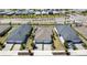 Aerial view of a neighborhood with a home featuring solar panels and a two-car garage at 17860 Palmetto Pass Ln, Punta Gorda, FL 33982