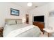 Cozy bedroom with neutral color palette, artwork, and ample natural light at 17860 Palmetto Pass Ln, Punta Gorda, FL 33982