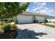 Beautiful home with a two-car garage and lovely stone driveway and landscaping at 17860 Palmetto Pass Ln, Punta Gorda, FL 33982