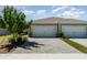 Beautiful home with a two-car garage and lovely stone driveway and landscaping at 17860 Palmetto Pass Ln, Punta Gorda, FL 33982