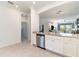 Bright kitchen featuring granite counters, stainless appliances, and an open layout at 17860 Palmetto Pass Ln, Punta Gorda, FL 33982
